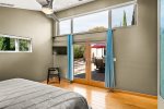 Master bedroom has doors that lead to the back patio